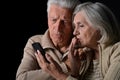 Sad Senior couple with phone Royalty Free Stock Photo