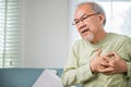 Sad senior man feeling bad pain use hand touching chest having heart attack Royalty Free Stock Photo