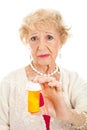 Sad Senior Woman with Pills Royalty Free Stock Photo