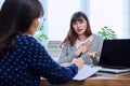 Sad, serious teenage girl at session in office of mental professional Royalty Free Stock Photo