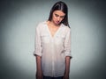 Sad shy insecure woman looking down avoiding eye contact Royalty Free Stock Photo