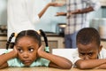 Sad siblings against parents arguing Royalty Free Stock Photo