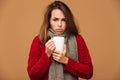 Sad sick caucasian woman drinking hot tea.