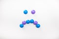 A sad smile made from children`s toys. Multicolored figures for games