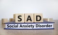 SAD, social anxiety disorder symbol. Concept words `SAD, social anxiety disorder` on cubes on a beautiful white background. Royalty Free Stock Photo