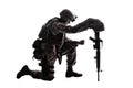 Sad soldier kneeling because of friend death Royalty Free Stock Photo