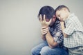 Sad son hugging his dad Royalty Free Stock Photo