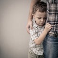 Sad son hugging his dad Royalty Free Stock Photo