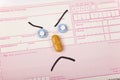 Sad stickman face made from tablets and pills on a german recipe Royalty Free Stock Photo