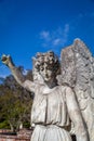 Old stone angel on a grave in a cemetery. Royalty Free Stock Photo