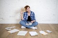 Sad stressed woman with calculator and bank and bills paperwork and documents doing domestic financial accounting Royalty Free Stock Photo