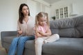 Offended little girl ignore young mom talking Royalty Free Stock Photo