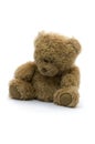 Sad teddy bear isolated on white background