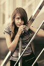 Sad teen girl against a school building Royalty Free Stock Photo