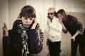 Sad teen girl calling on cell phone at the wall Royalty Free Stock Photo