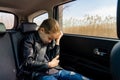 Sad teen girl crying seat back of car Royalty Free Stock Photo