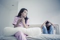 Sad teenage couple with pregnancy test on bed Royalty Free Stock Photo