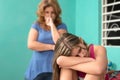 Sad teenage girl and her worried mother at home Royalty Free Stock Photo