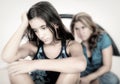 Sad teenage girl and her worried mother Royalty Free Stock Photo