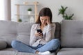 Sad teenage girl receive bad message on smartphone