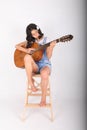 Sad teenage girl playing guitar Royalty Free Stock Photo