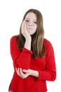 Sad teenage girl with tooth pain. Dental problem - adorable girl suffering from toothache. Royalty Free Stock Photo