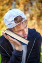 Sad Teenager with a Book Royalty Free Stock Photo