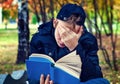 Sad Teenager with a Book Royalty Free Stock Photo