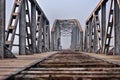 Sad teenager in depression sitting on the bridge at the sunset. Royalty Free Stock Photo