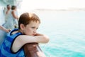 Sad thoughtful little boy looking at the sea Royalty Free Stock Photo