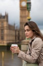 Sad Thoughtful Woman Drinking Coffee in London by Big Ben Royalty Free Stock Photo