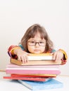 Sad tired girl with stack of books Royalty Free Stock Photo