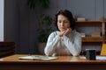 Sad tired ill sick lonely disappointed older senior woman sitting at home alone. Unhappy mature grandmother experiencing Royalty Free Stock Photo