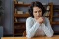 Sad tired ill sick lonely disappointed older senior woman sitting at home alone. Unhappy mature grandmother experiencing Royalty Free Stock Photo