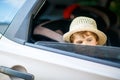 Sad tired kid boy sitting in car during traffic jam Royalty Free Stock Photo