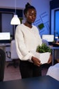 Sad tired resigned african american businesswoman leaving business job Royalty Free Stock Photo