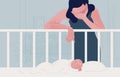 Sad tired woman leaning over newborn baby sleeping in crib and covering face with hand. Concept of postpartum or