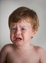 Sad toddler, crying and portrait of boy in his home with emotional anger or loss in childhood. Moody, trouble and house Royalty Free Stock Photo