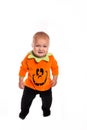 Sad Toddler dressed as a pumpkin for Halloween