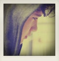 Sad troubled school boy teenager wearing a hoodie posing and thinking in his own thoughts - close up stock Royalty Free Stock Photo