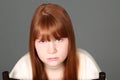 Sad tween redhead girl with freckles