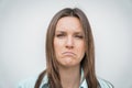 Sad unhappy and disappointed woman face. Young woman frowning face. Facial expression of feeling sadness.