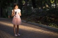 Sad upset Caucasian girl hugging toy. Child embrace soft plush bear in park outdoors. Lost lonely child kid outside Royalty Free Stock Photo