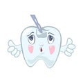 Sad, upset tooth with hole, cavity on top looking to stomatological instrument which touching him.