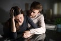 Sad wife and husband comforting her in the night at home Royalty Free Stock Photo