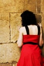 Sad woman against wall Royalty Free Stock Photo
