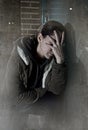 Sad woman alone leaning on street window at night suffering dep Royalty Free Stock Photo