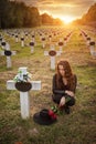 Sad woman in the cemetery . Royalty Free Stock Photo