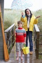 Sad woman and child with umbrella Royalty Free Stock Photo