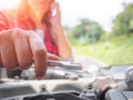 Sad woman could not fix the car. Royalty Free Stock Photo
